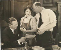 Original press photograph of Leatrice Joy being presented a "star contract" by Cecil B. DeMille and Jesse L. Lasky, 1924