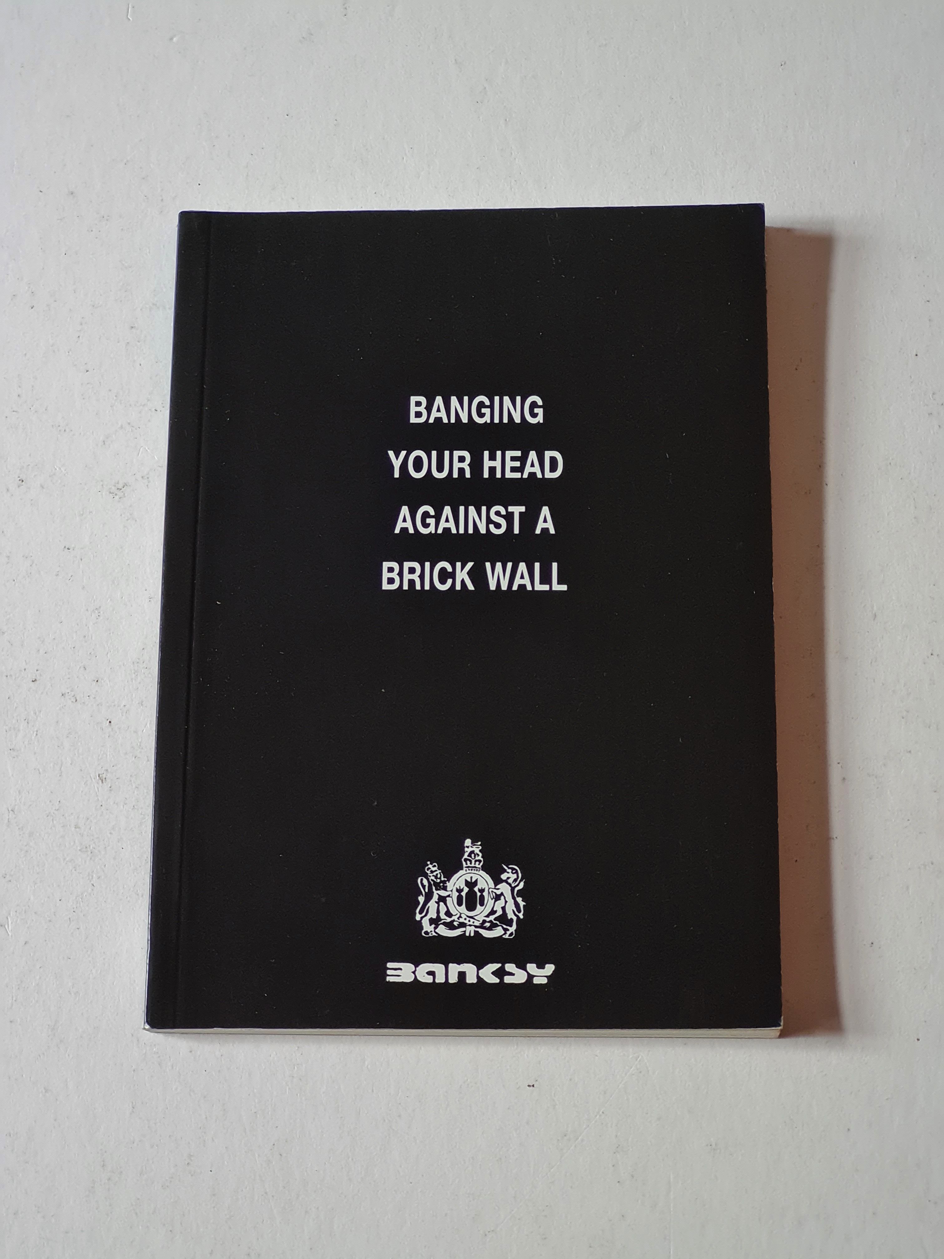 BIBLIO Banging Your Head Against a Brick Wall by Banksy Paperback