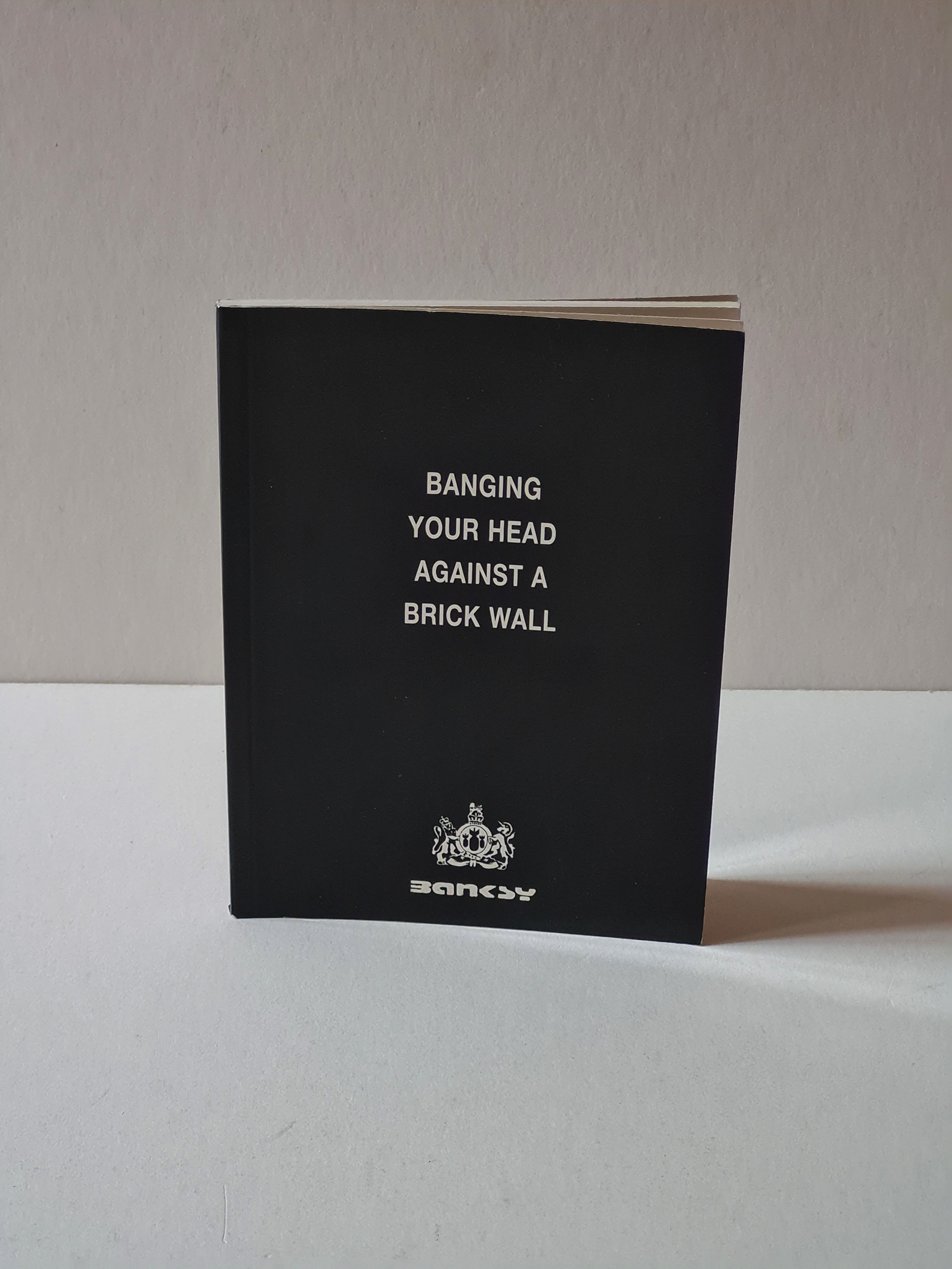 BIBLIO Banging Your Head Against a Brick Wall by Banksy Paperback