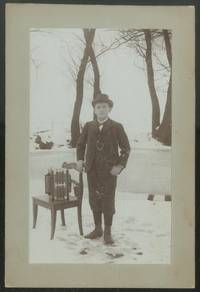 Cabinet Photograph of a Boy with an Accordion in the Snow