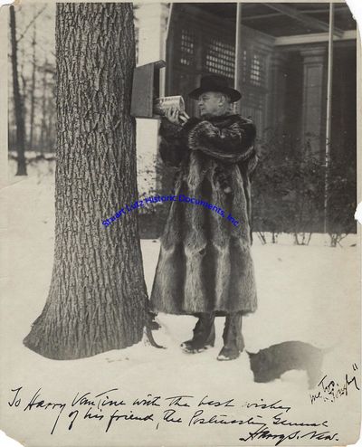 Postmaster General Harry New Signs A Photo Of Himself And His Dog