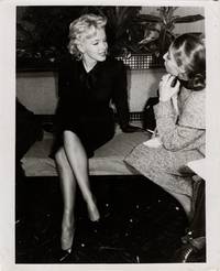 Original photograph of Marilyn Monroe being interviewed in Los Angeles, 1956