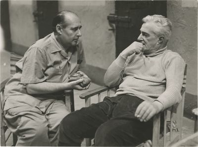 N.p.: N.p., 1959. Vintage borderless reference photograph of Roberto Rossellini and Vittorio De Sica...