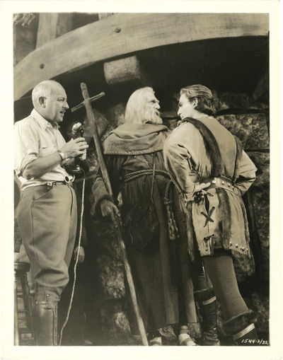 N.p.: N.p., 1935. Two vintage reference photographs of Cecil B. DeMille on the set of the 1935 film,...