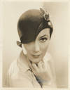 DOLORES DEL RÍO MODELS HAT AT WARNER BROTHERS (ca. 1935) Studio publicity portrait
