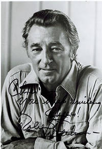 Smiling Portrait of Robert Mitchum. Signed.