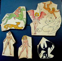 A COLLECTION OF WOODEN JIGSAW PIECES IN VARIOUS SHAPES AND SIZES