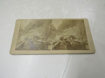 Stereoview showing John Merrill (1802-1892) at one of the pools in the White Mountains with a group of tourists