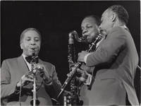 Original photograph of Harold Ashby, Harry Carney, and Russell Procope in concert in Paris, 1966