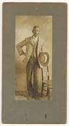 [Cabinet card photograph]: Impressively Mustached Young African-American Man. Circa 1885