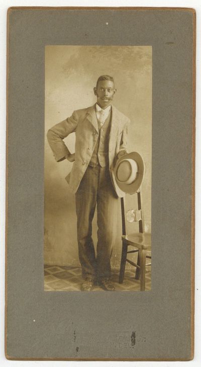 [Cabinet card photograph]: Impressively Mustached Young African-American Man. Circa 1885