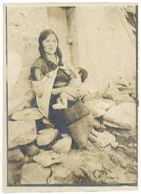Photograph of a Navajo Woman breast feeding a baby, circa 1895