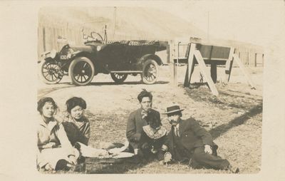 Real Photo Postcard of an Asian-American Family Relaxing by Their Model T Touring Car, c. 1917