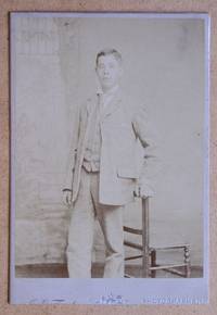 Cabinet Photograph: A Studio Portrait of a Young Man in a Suit.