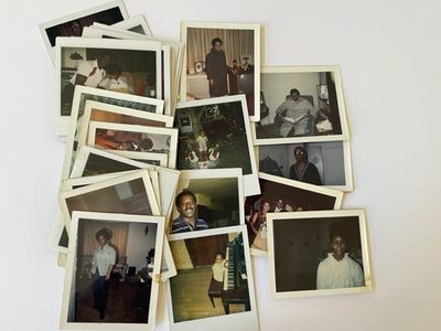 Archive of 33 vernacular Polaroid's of African Americans alone or in small groups mainly doing ordin...