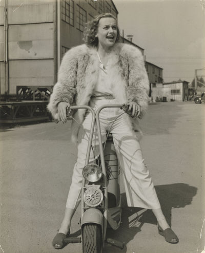 N.p.: N.p., 1938. Vintage borderless press photograph of actress Carole Lombard in a fur coat and hi...