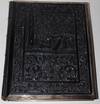 Photo Album with Boards of Irish Black Bog Oak, With Elaborate Relief Decoration, and With Silver Border Framing the Boards