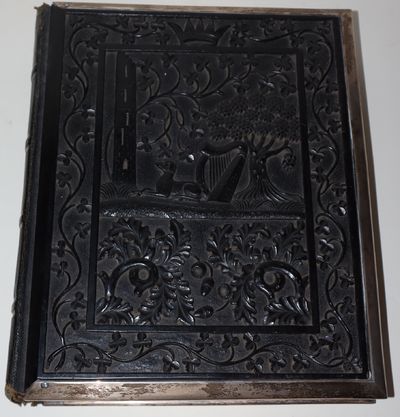 Photo Album with Boards of Irish Black Bog Oak, With Elaborate Relief Decoration, and With Silver Border Framing the Boards