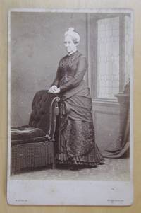 Cabinet Photograph. Studio Portrait of a Lady Beside a Chair.