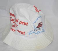 Cloth hat imprinted with the slogan; "N'Importe qui peut l'attraper, tout le monde peut l'eviter" roughly translates as [Anyone can catch it, everyone can avoid it]