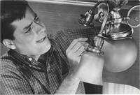 Two original photographs of Jerry Lewis changing a light bulb, circa 1950s