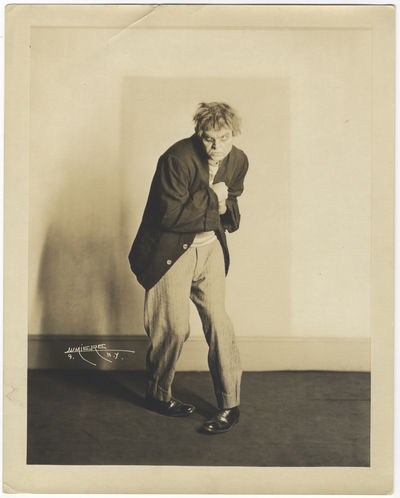 Original full-length role portrait photograph of the prominent American baritone as Tonio in Leoncavallo's Pagliacci together with cut signature laid down to ivory paper mount