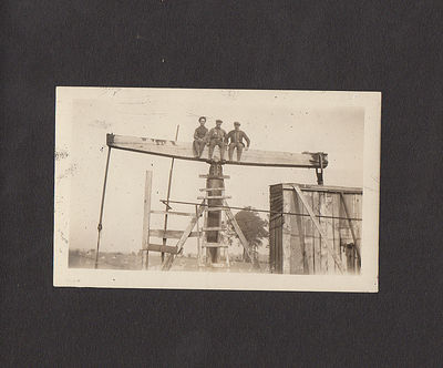 Photograph album documenting two itinerant roughnecks' travel through New York, Pennsylvania, and Ohio until they found jobs at the Woodville Oil Field