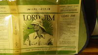 LORD JIM: A Tale  Stated First Modern Library Edition 1931  IN Green & White Early VINTAGE DJ with SIDE PROFILE FACE OF Man in Safari Hat smoking Pipe,  Theme of a heroic man