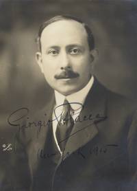 Bust-length Mishkin photograph of the operatic conductor in formal dress with autograph signature