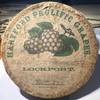 Paper decorated container with a lid bearing "Hartford Prolific Grapes" label