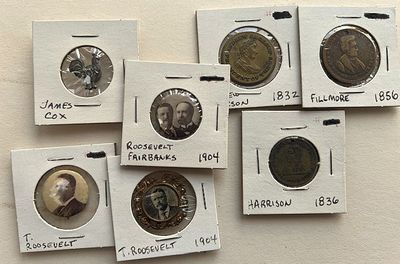Selection of 13 pinbacks, tokens, and photographic buttons
