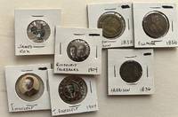 Selection of 13 pinbacks, tokens, and photographic buttons
