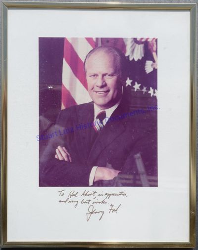 Gerald Ford Signs An Oversized Photograph