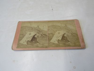 Stereoview which shows William Henry Jackson outside his photographic dark tent with the materials needed to create wet plate photograph
