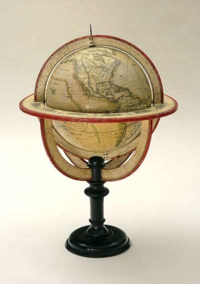 9 ½ inches (24 cm.) diameter; 21 inches (53 cm.) total height. Single pedestal globe with horizon r...