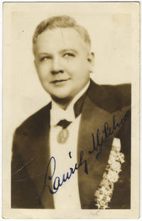 Waist-length photograph in formal attire, signed in full