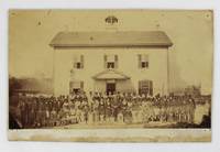 [Albumen Photograph Featuring Rev. J.L.A. Fish and His Wife Posed with Their African American Students Outside a 
