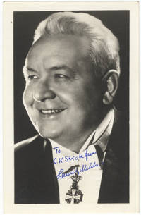 Bust-length photograph in formal attire as Commander of the Order of the Dannebrog. Signed in full and inscribed in blue: "To C. K. Strate from Lauritz Melchior