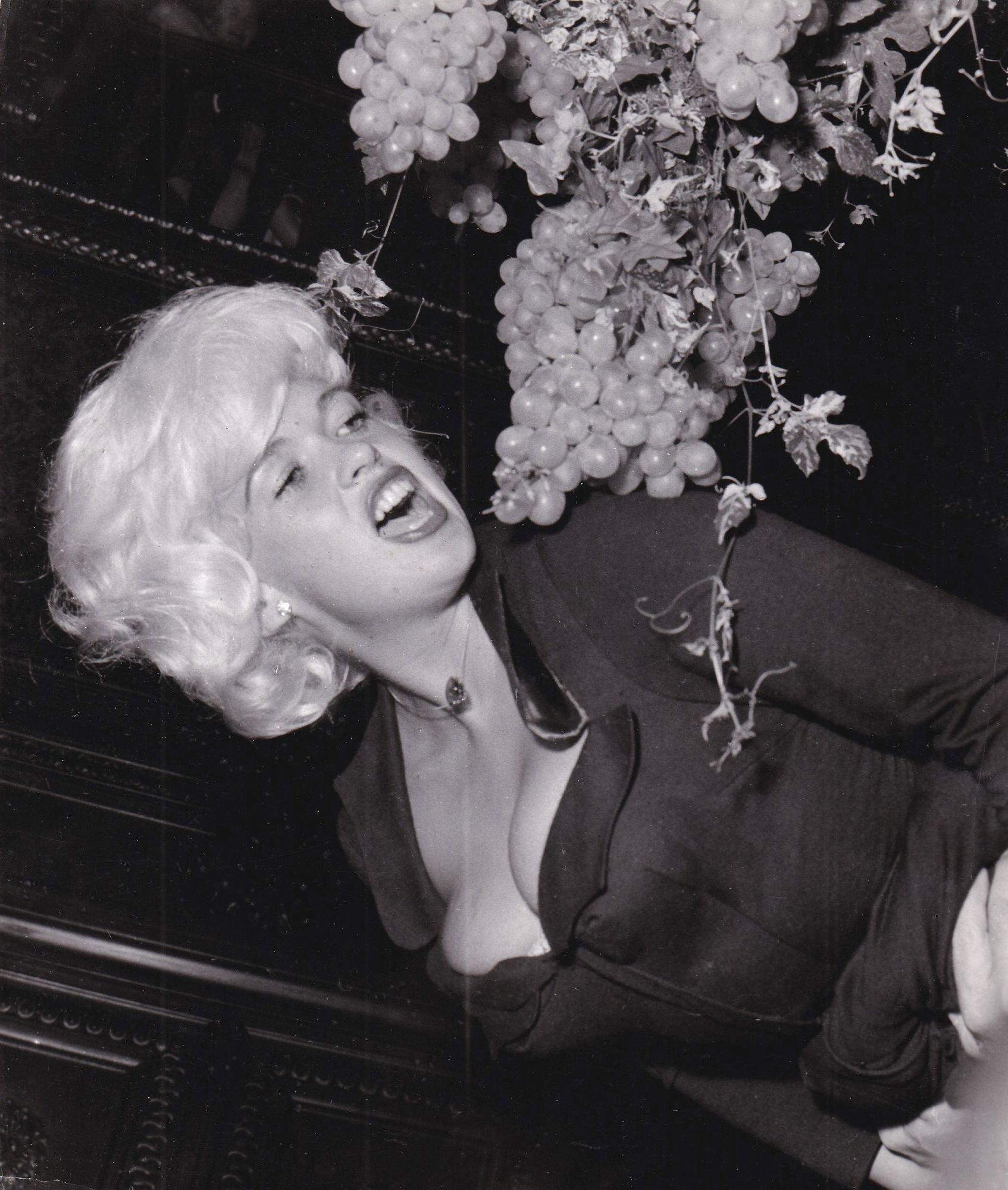 Jayne Geisel Original photograph of Jayne Mansfield eating grapes at a party in ...