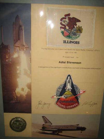 This flag and crew patch were flown aboard the Space Shuttle "Columbia" (STS-1) / April 12-14, 1981 / Presented to / Adlai Stevenson / In recognition of the significant contributions you made to the success of this mission