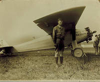 Original photograph of Charles Lindbergh next to the Spirit of St. Louis.  Signed.