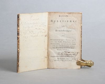 Politiske Aphorismer. Christiania, Trykt i det Wulfsbergske Bogtrykkerie, 1826. 99 s. + Medbundet i front: (Broch, Johan Jørgen): Politiske Aphorismer eller Bemærkninger over Statsforfatninger i Almindelighed, over den Norske Statsforfatning i Særdeleshed, over de til Afgjørelse paa førstkommende ordentlige Storthing fremsatte Constitutionsforslage. (photo 2)