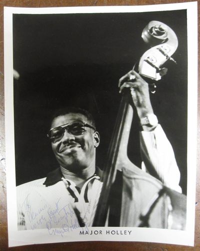 1962. unbound. 10 x 8 inches, no place, no date, circa 1962 -- a promotional image of a smiling Holl...