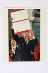 NELSON MANDELA HOLDING UP HIS HONORARY DOCTORATE DEGREE FROM HARVARD UNIVERSITY PHOTOGRAPH [Signed]