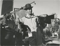 image of Original oversize photograph of Jerry Lewis in a bowler hat and jumpsuit, circa 1960s