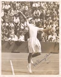 Fine Action Photo by the Photographic  News Archives of Fleet Street, signed and dated (Henry Wilfred., 'Bunny', 1906-2000, English tennis player)