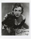 Bust-length role portrait photograph in the title role of Bizet's Carmen, signed in full