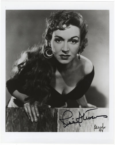 Bust-length role portrait photograph in the title role of Bizet's Carmen, signed in full