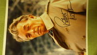 Robert Mitchum SIGNED Color Photograph With Him Wearing Trenchcoat