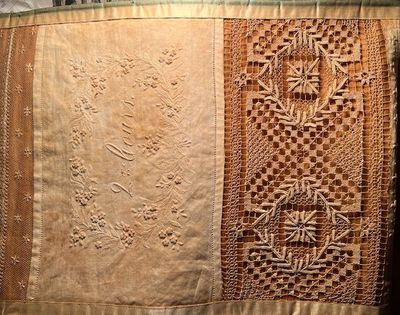 19th century sampler of a girl's proof of mastering lace making and sewing skills.